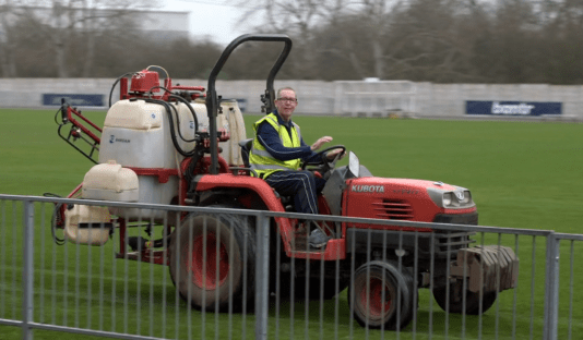 Man on riding lawnmower