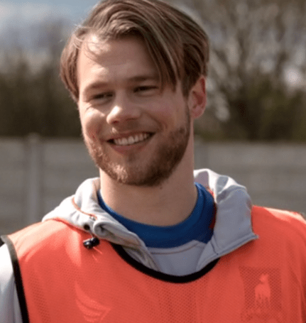 Man in a orange vest